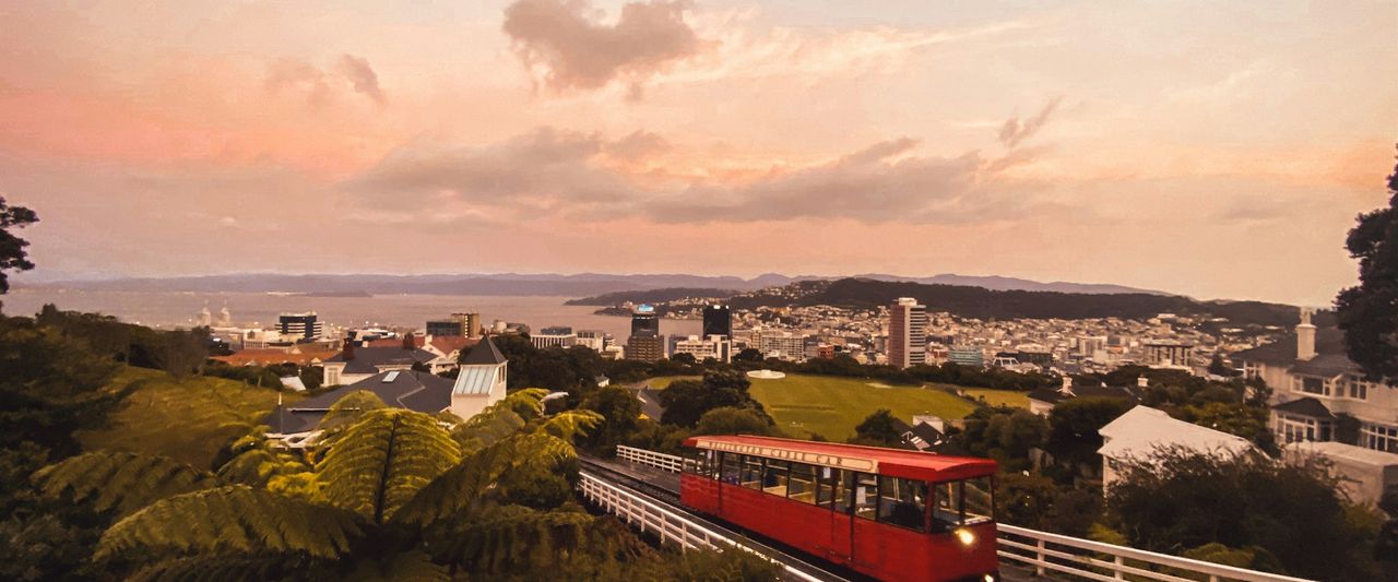 The red Wellington cable car on its track in the evening