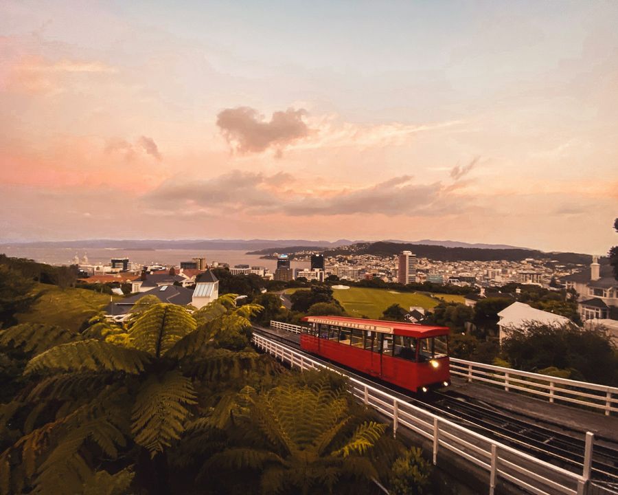 The red Wellington cable car on its track in the evening